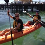 Two people enjoying a kayak adventure.