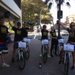 A group of people on bicycles participating in a small business marketing workshop.
