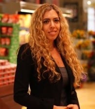 A woman participating in a marketing workshop in a grocery store.