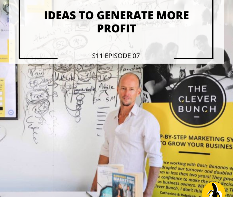 A man attending a marketing workshop, standing in front of a wall with the words ideas to generate more profit as part of his small business marketing plan.