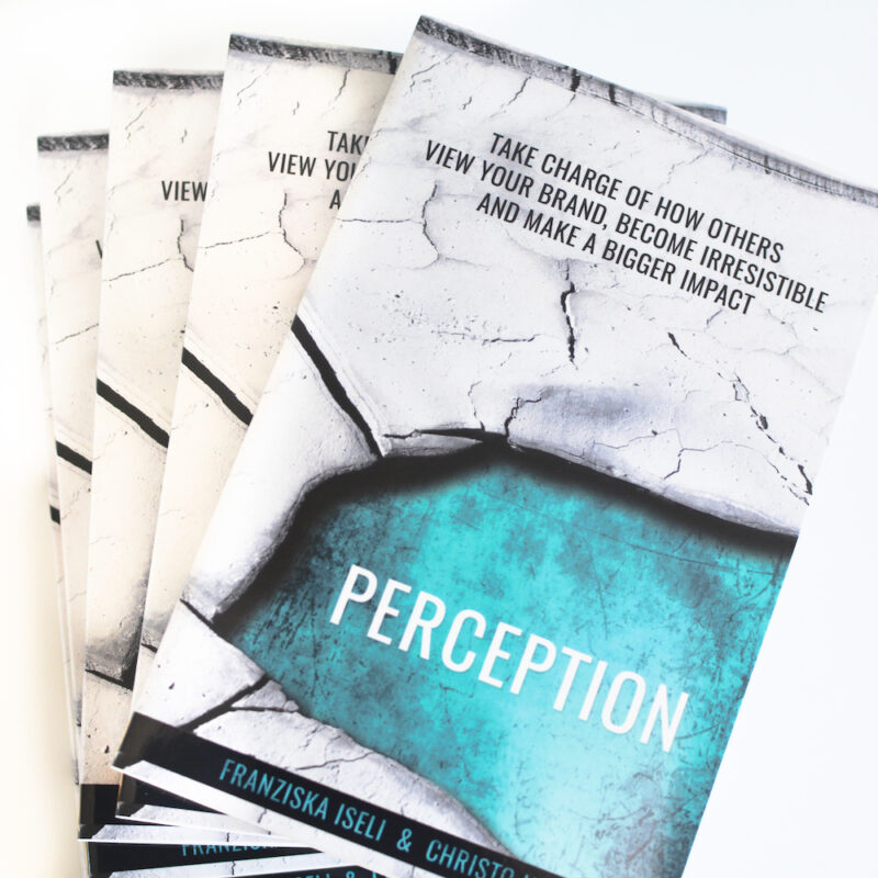 A stack of Perception books on marketing plan and small business marketing.