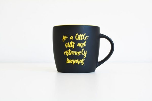 A black mug with gold lettering that says i'm a little gift, perfect for small business marketing.