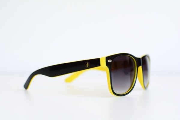 A pair of I See You Sunglasses on a white surface, perfect for small business marketing.