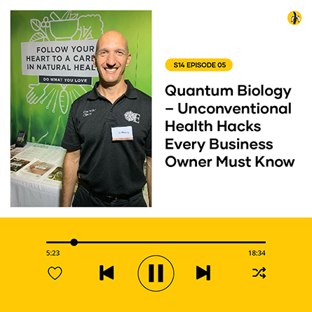 Smiling man at a health expo booth, labeled "quantum biology - hacks every business owner must know," showing podcast play screen.